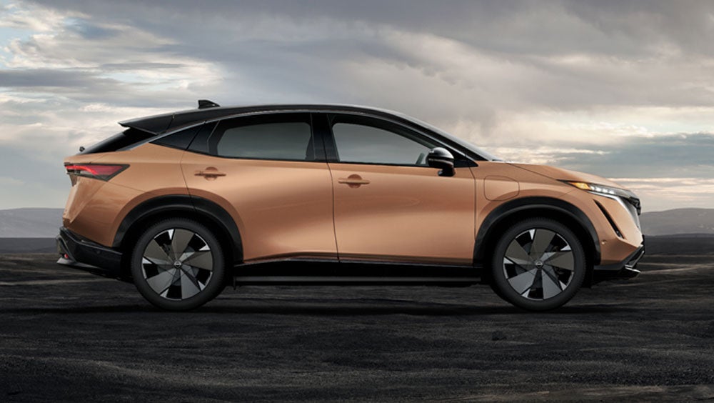 Nissan ARIYA in Sunrise Copper in dramatic landscape | Clay Cooley Nissan of Irving in Irving TX